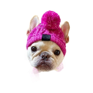 Pink knitted pet hat with fluffy pompom and ear protection for dogs and cats
