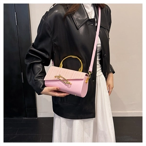 Pink PU leather crossbody bag featuring gold metal handle and chain buckle detail