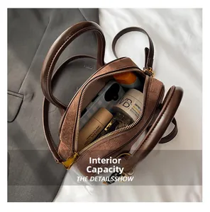 Interior view showing the capacity of this brown suede crossbody bag for daily essentials