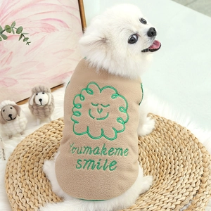 Warm khaki fleece pet vest with green embroidery for small dogs shown on a Pomeranian