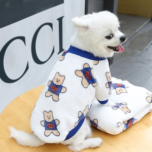 Detail of white plush dog hoodie with bear print and blue ribbed cuffs for small pets
