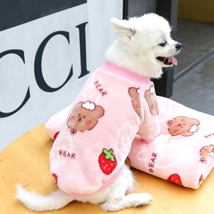 Detailed texture of pink flannel dog hoodie with bear and strawberry prints for winter