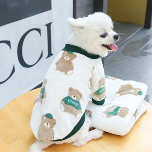 Detail of plush pet hoodie and matching blanket with bear print for small dogs