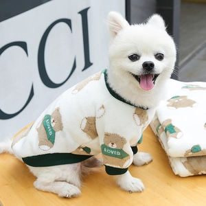 Plush white pet sweater with brown bear patterns and green ribbed trim for small dogs