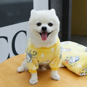 Yellow fleece dog hoodie with cartoon monkey print and matching soft pet blanket