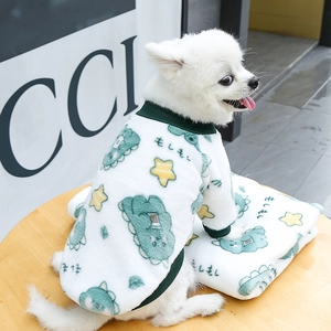 Detail of white plush pet sweater with green dinosaur prints and ribbed cuffs for small dogs
