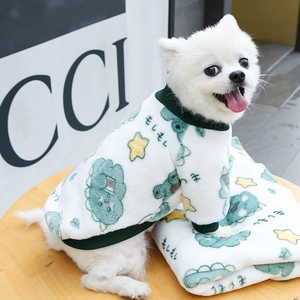 Detail of white flannel pet sweater with dinosaur print and green ribbed edges