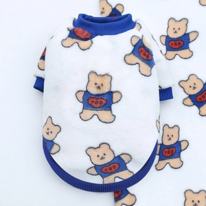 Detailed texture of white fleece pet sweatshirt featuring blue ribbed edges and bear prints
