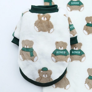 Close-up of soft fleece pet sweater with cute bear prints and green ribbed cuffs