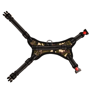Macro detail of camouflage dog harness with reflective strap and safety buckle