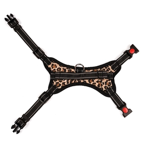 Detail of leopard print dog harness featuring reflective edges and red safety locks