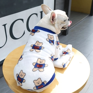 Detail of warm white fleece pet sweater with cute bear prints and blue ribbed edges