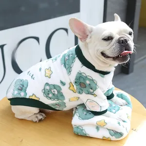 Detailed texture of thick fleece pet hoodie with cartoon dinosaur prints and ribbed cuffs