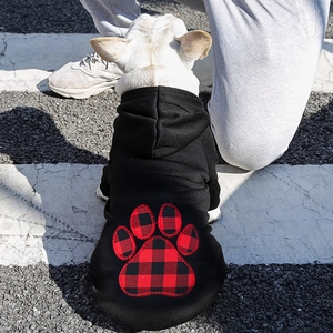 Detail of black pet hoodie showing buffalo plaid paw applique on the back for dogs