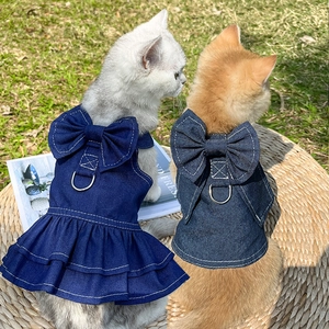 Denim pet dress with ruffle hem and large bowknot featuring metal D-ring for leash attachment