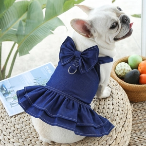 Detail of dark blue denim dog dress with bow and D-ring for leash on French Bulldog