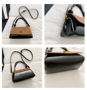 Detail view of suede patchwork crossbody bag with golden clasp and adjustable strap