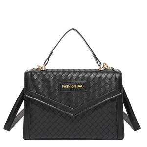 Elegant black woven leather handbag with fashion label and gold hardware details