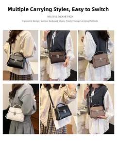 Detail showing the adjustable shoulder strap and metal clasp of the stylish square handbag