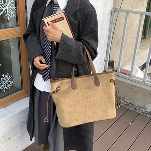 Large light brown suede tote bag with leather straps for daily commute use