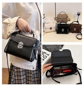 Detail view of the spacious inner compartments and secure zipper pockets of the square bag