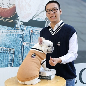 Close-up of academic style pet knit vest with crown embroidery for cat and dog