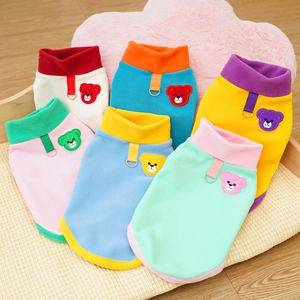 Detail of fleece pet vests with colorful contrast bear embroidery and metal D-rings