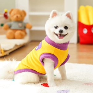 Detail of yellow fleece pet vest with purple bear embroidery and contrast neckline