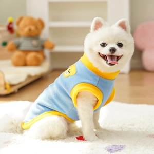 Blue and yellow polar fleece pet vest with a cute cartoon bear embroidery detail