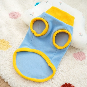 Flat lay of a warm blue and yellow polar fleece pet vest for dogs and cats in autumn