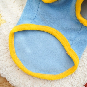 Detailed close-up of soft polar fleece pet sweater with yellow trim and blue fabric