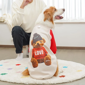 Detail of fleece pet hoodie with teddy bear print and metal D-ring for leash attachment