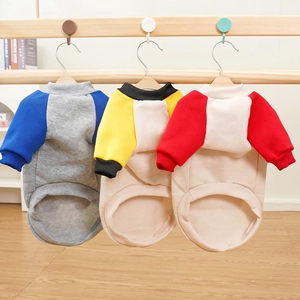 Detailed view of winter fleece pet hoodies in three colors on wooden hangers