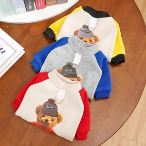 Three colorful knitted pet hoodies with cartoon bears and integrated D-ring traction buckles
