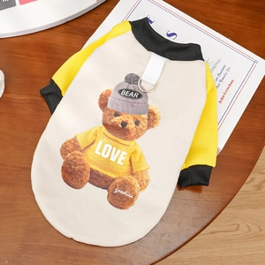 Detail of pet hoodie with bear print, ribbed cuffs, and D-ring for leash attachment