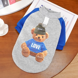 Detail view of pet hoodie featuring a teddy bear print and metal D-ring for leash attachment