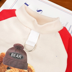 Detail of pet fleece hoodie with raglan sleeves and a metal D-ring for leash attachment
