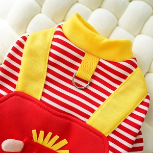Detail of red-white striped dog vest with metal D-ring and yellow sun patch