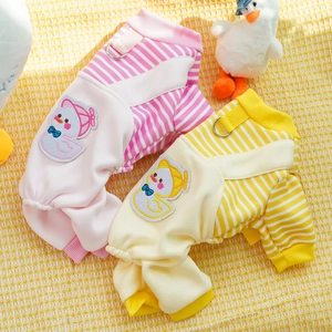 Detail of dog onesies with metal D-ring and cartoon duck patch on striped fabric