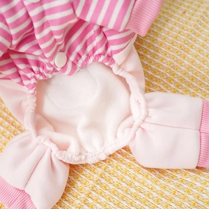 Detail of soft fleece lining and pink white striped fabric on a pet jumpsuit