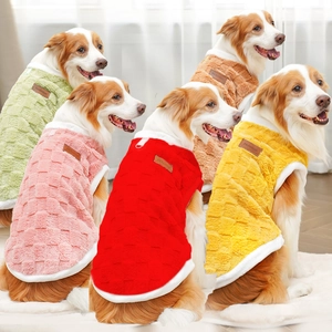 Detail of plush pet vests showing waffle texture fabric and soft fur trim for winter