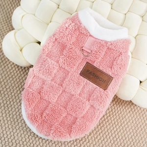 Detail of pink fleece pet vest featuring a sturdy metal D-ring for leash attachment
