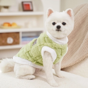Detail of soft green teddy fleece pet vest with plush white edges for small dogs and cats