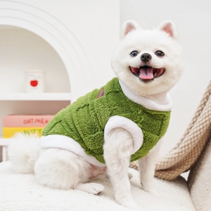 Detail of a green fleece pet vest for small dogs and cats with warm white trim edges