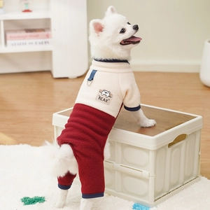 Detail of warm dog fleece jumpsuit with metal leash D-ring and cute bear patch
