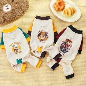 Detailed view of three colorful pet four-legged hoodies with bear prints and D-rings