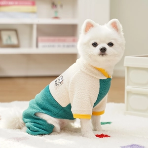 Detail of warm fleece dog onesie with bear embroidery and contrast color piping