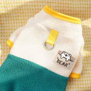 Detail of pet fleece vest with color blocking, metal D-ring, and cute bear patch