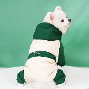 Close-up of waterproof dog jumpsuit with adjustable waist drawstring on a white dog