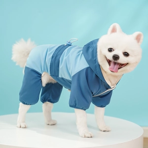 Detail of waterproof dog jumpsuit featuring blue splicing design and adjustable drawstring
